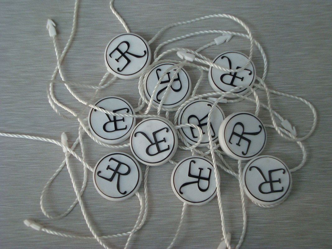 custom wholesale garment plastic hang tag manufacturer with emboss black logo